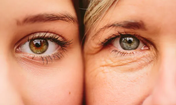 Close Up Of Mother And Daughter Faces Together