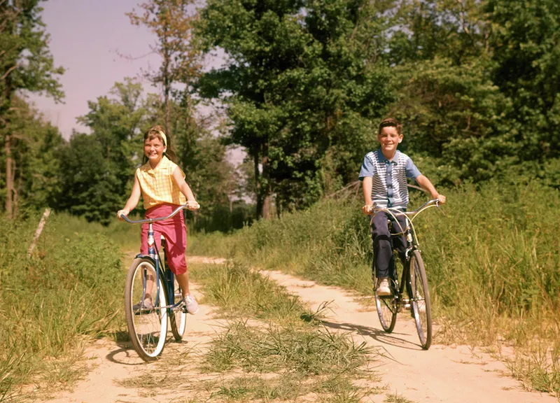 1960sOY AND GIRL RIDING…