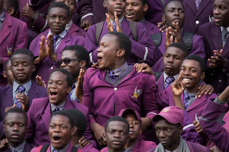 Non-playing pupils from Churchill High School cheer on their 1st XV rugby team as they play against arch rivals, Prin...
