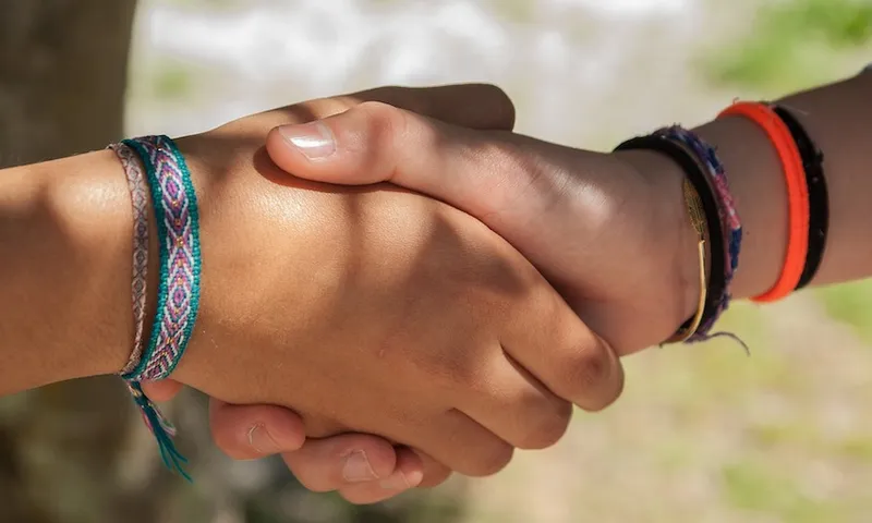 children shaking hands