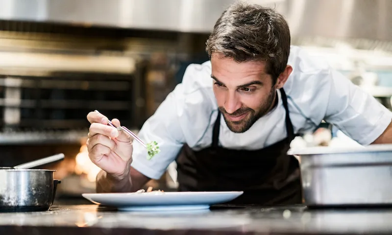 Chef preparing food in a restaurant kitchen