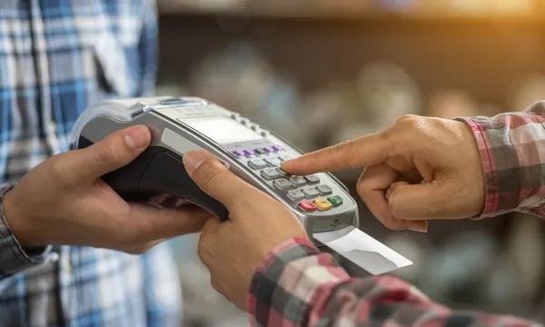 a finger press on credit card