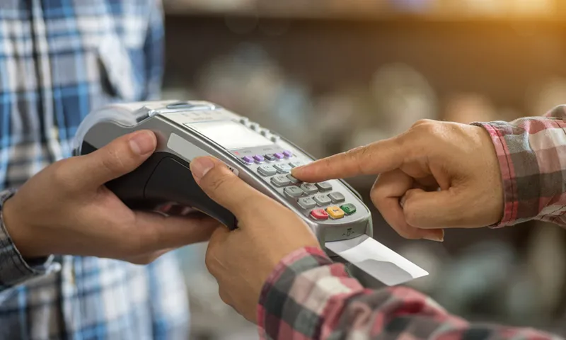 a finger press on credit card