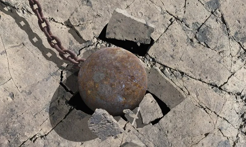 Close up of wrecking ball cracking concrete