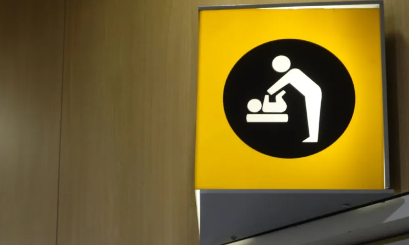 stock baby changing bathroom sign getty