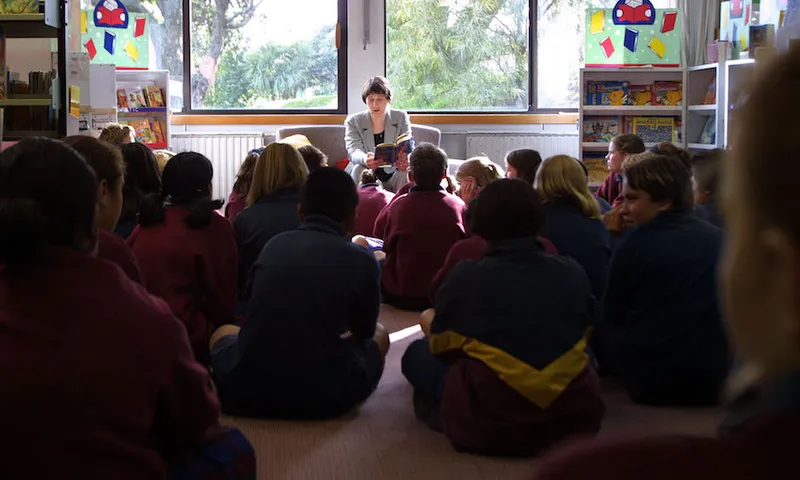 Prime Minister Helen Clark reads to students at Ko