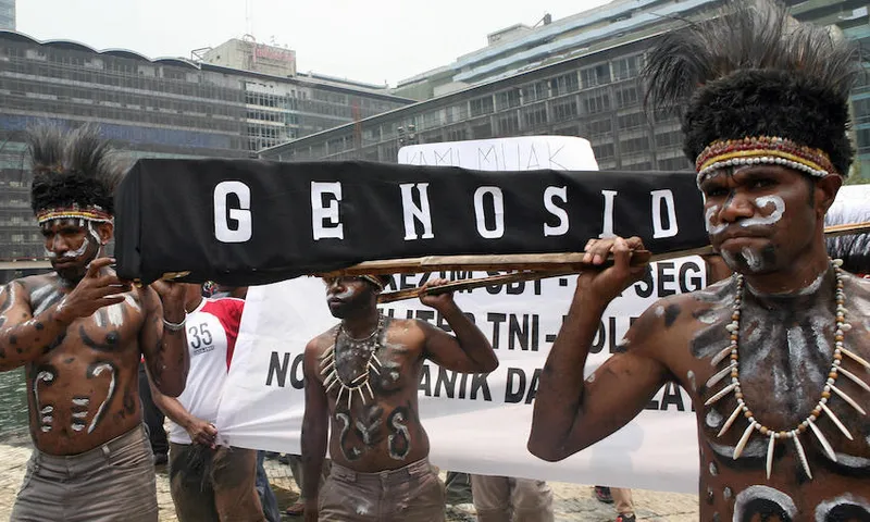 Papuan youths carry a mock coffin during