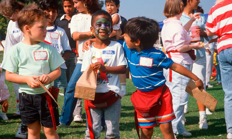 Multi-cultural group of boys at park celebration, Los Angeles, California