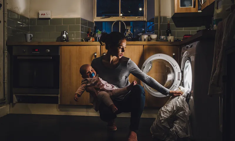 Multi-Tasking Mother doing household chores