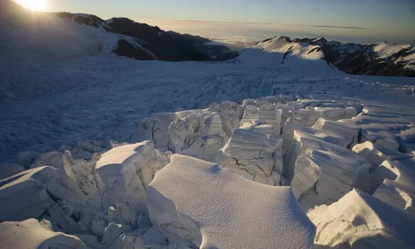 New Zealand, South Island, Fox Glacier at sunset, aerial view