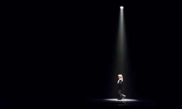 Woman Standing In Darkroom