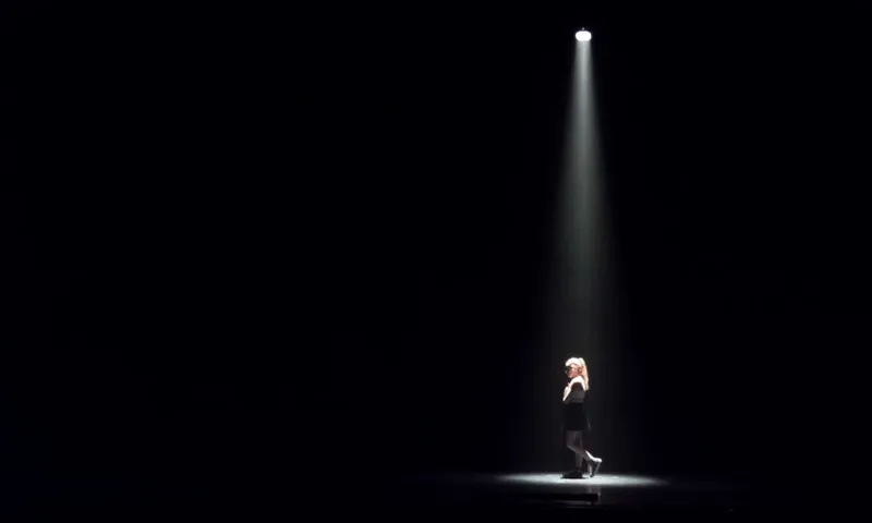 Woman Standing In Darkroom