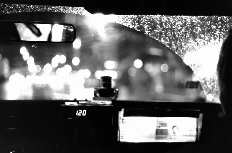 The interior of a taxi at night
