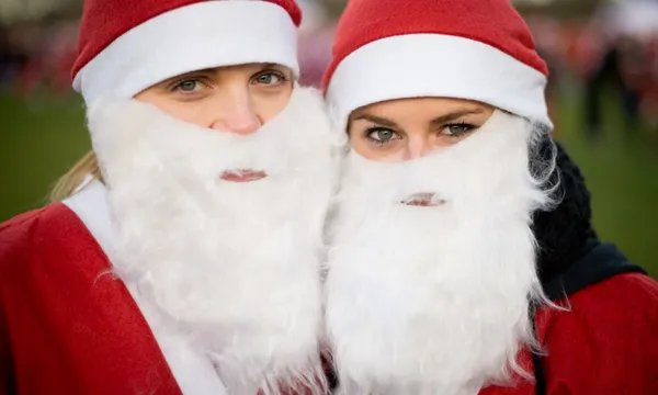two women dressed as santa getty images