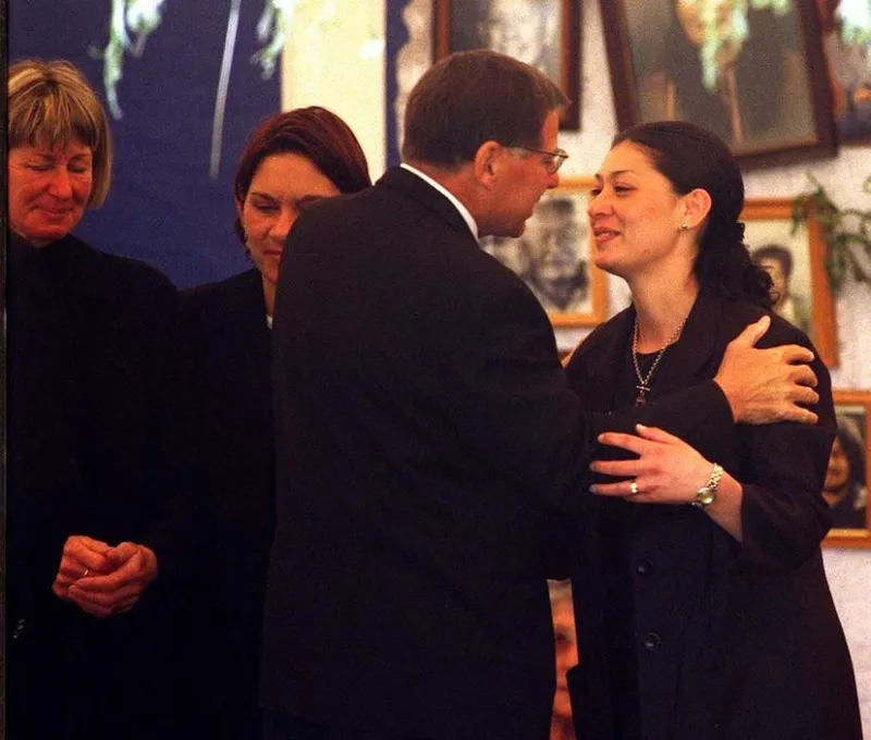 Aaron Hopa's fiance Tracy Frame is consoled by All