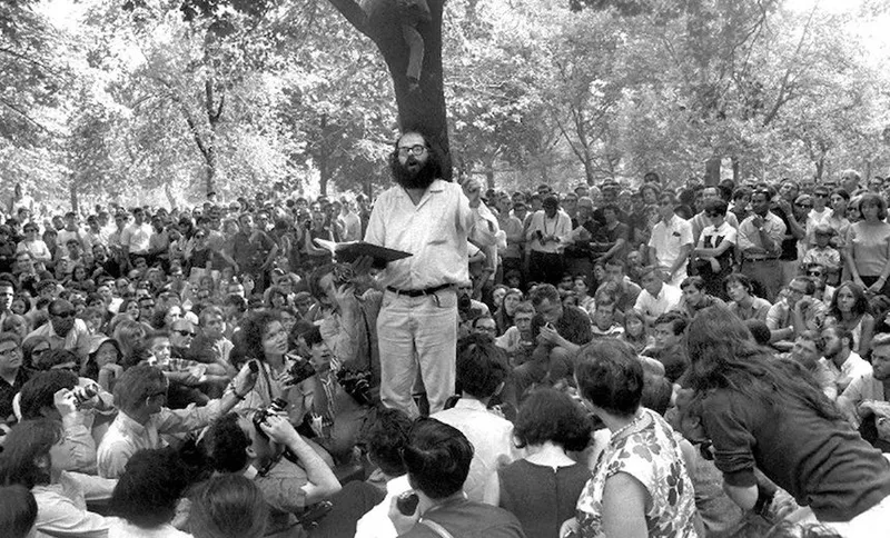 Poet Allen Ginsberg reading his work to a crowd in Washingto