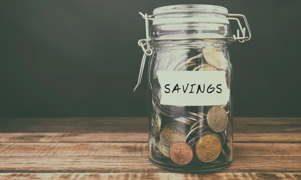 Coins in Jar With Text Savings
