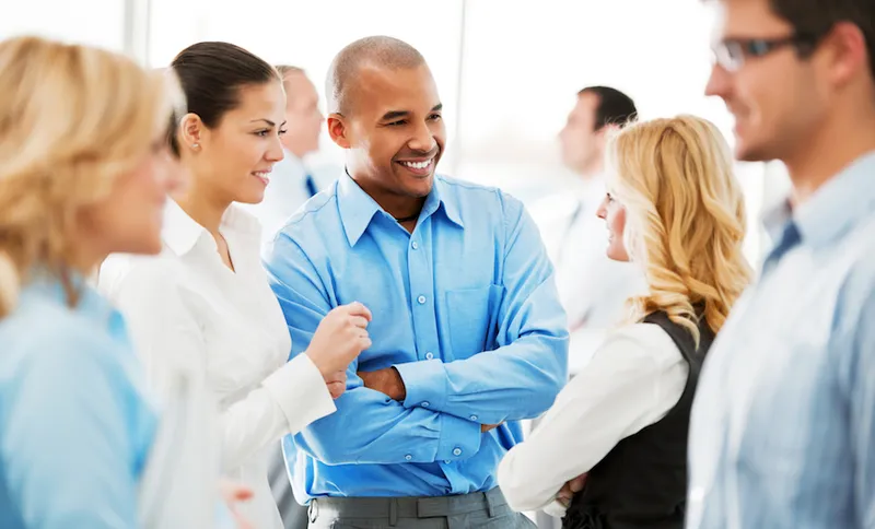 Laughing  businesspeople talking in the office.
