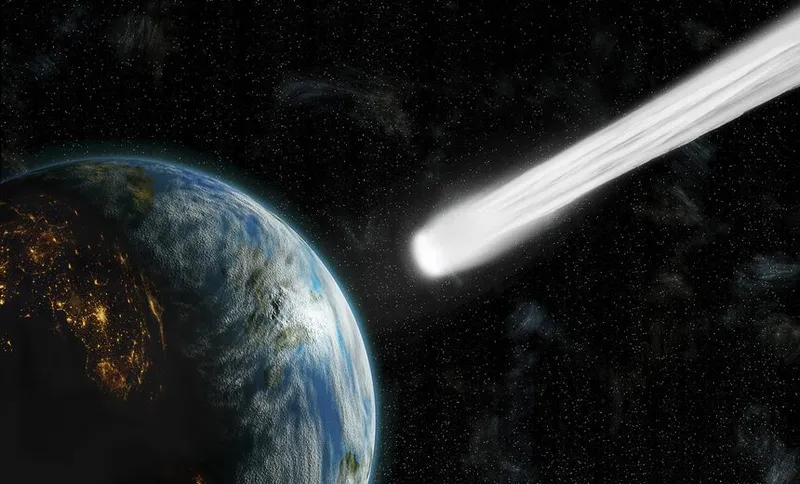 An artists depiction of an inhabited Earth-like planet facing an imminent collision with a comet. The nigntside glows with city lights.