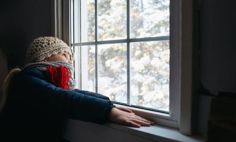 Girl looking out of window