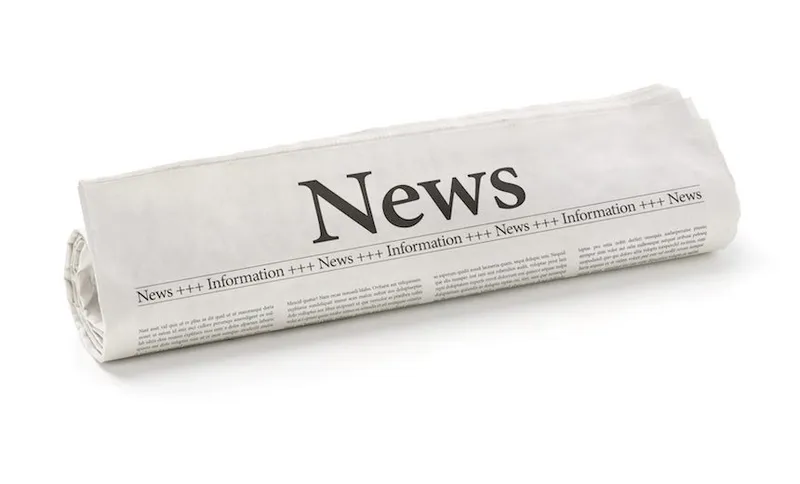 Rolled newspaper with the headline News