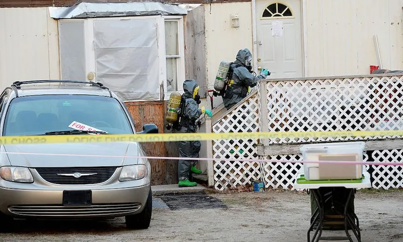 Members of the Maine Drug Enforcement Agency investigate a possible methamphetamine lab in Buxton
