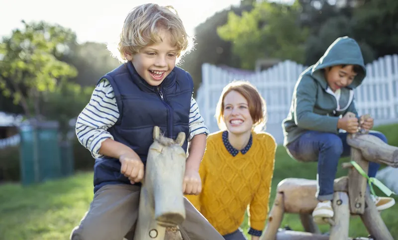 Teacher and students playing outdoors