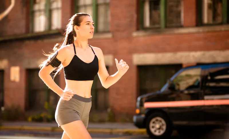 fitness woman running on the street