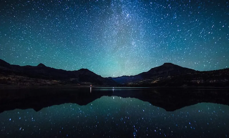 Milky way in the sky with Silhouette mountain.