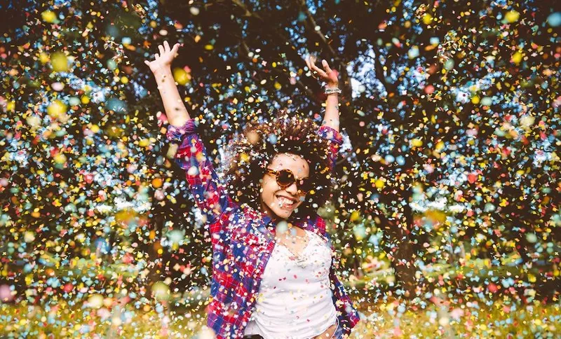 Hipster enjoying confetti