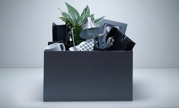 Box packed with desk objects