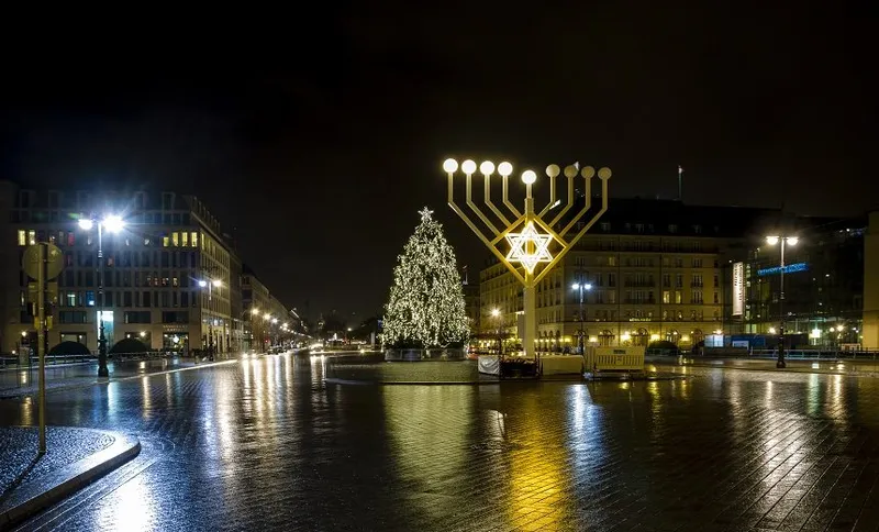 Germany, Berlin, giant Hanukkah menorah near Brandenburg Gate at night