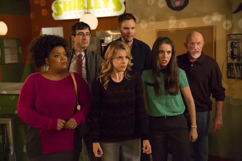COMMUNITY -- "Analysis of Cork-Based Networking" Episode 506 -- Pictured: (l-r) Yvette Nicole Brown as Shirley, John Oliver as Professor Ian Duncan, Gillian Jacobs as Britta, Joel McHale as Jeff, Alison Brie as Annie, Jonathan Banks as Professor Buzz Hickey -- (Photo by: Justin Lubin/ NBC)