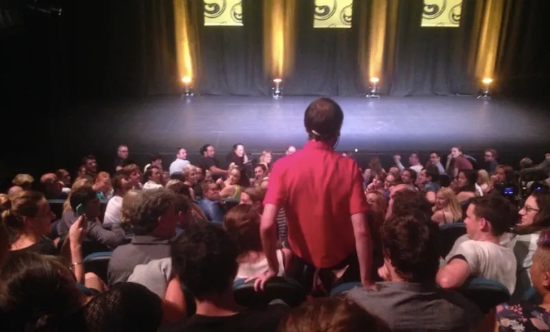 2015 Billy T winner Hamish Parkinson makes his way to the stage. Bad photo: author's own.