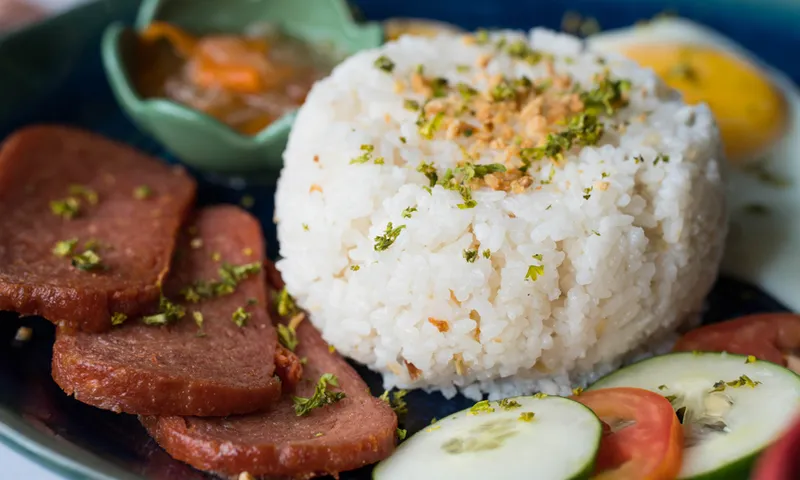 processed meat with garlic rice and fried egg on the side
