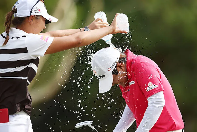 Lydia Ko and Haru Nomura in scenes probably reminiscent of the 1991 MTV Music Awards.  (Photo by Morne de Klerk/Getty Images)
