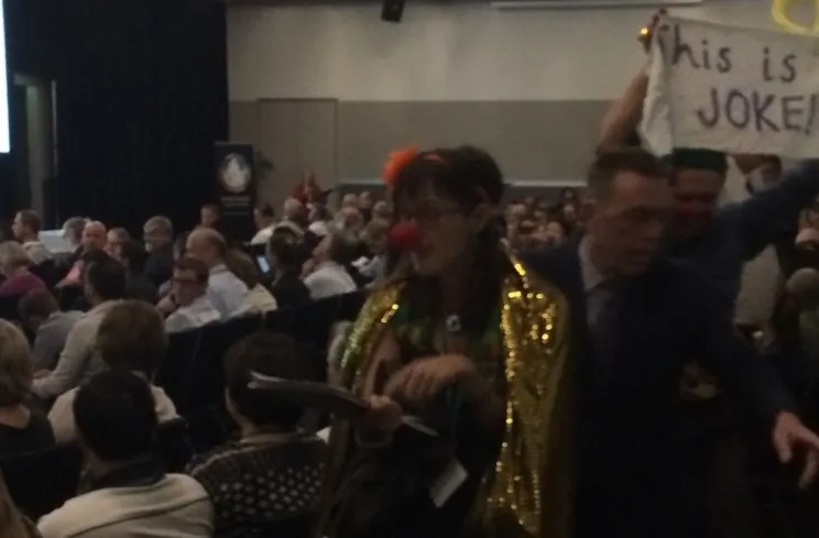 One of the giggling infiltrators dances out  (photo: Tim Murphy)