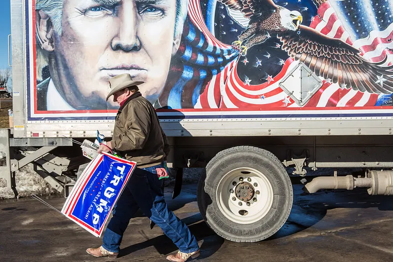DES MOINES, IA - JANUARY 28: Kraig Moss, a supporter of Republican presidential candidate Donald Trump, outside a truck with a Trump painting in which he is touring Iowa on January 28, 2016 in Des Moines, Iowa. The Democratic and Republican Iowa Caucuses, the first step in nominating a presidential candidate from each party, will take place on February 1. (Photo by Brendan Hoffman/Getty Images)