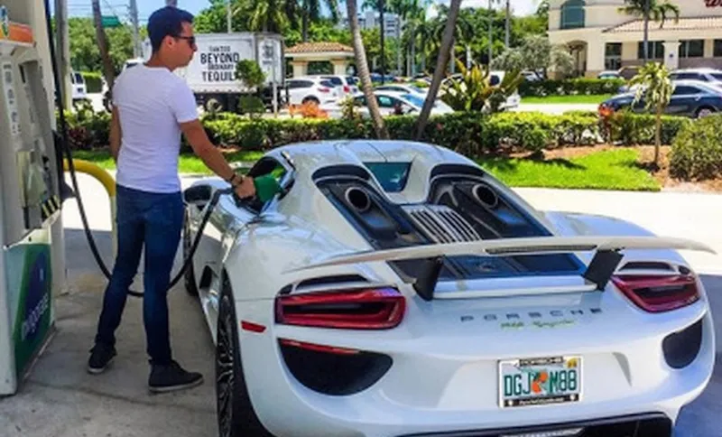 A YOUNG AUCKLAND HOUSE HUNTER FILLS UP HIS CAR
