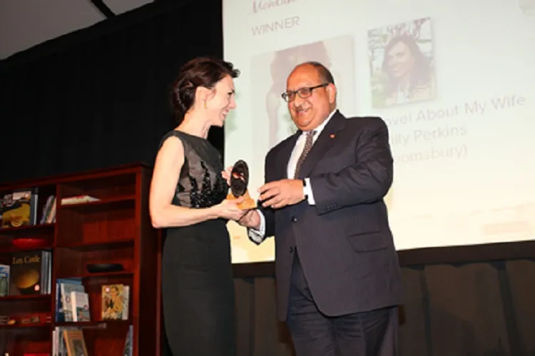 EMILY PERKINS, WINNER OF THE 2009 BOOK AWARD FOR NOVEL OF THE YEAR, MODELS A LITTLE BLACK  COCKTAIL DRESS HER PUBLISHER FOUND IN A VINTAGE STORE