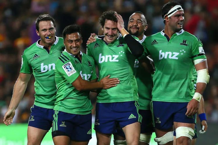 Highlanders teammates gather around the talismanic Marty Banks for good luck.  (Photo by Simon Watts/Getty Images)