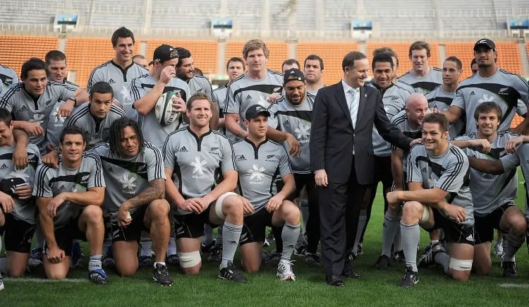 TOKYO - OCTOBER 30:  New Zealand Prime Minister John Key Richie McCaw of the All Blacks pose for a team photo during a New Zealand All Blacks Captain's Run at the National Stadium on October 30, 2009 in Tokyo, Japan.  (Photo by Ross Land/Getty Images)