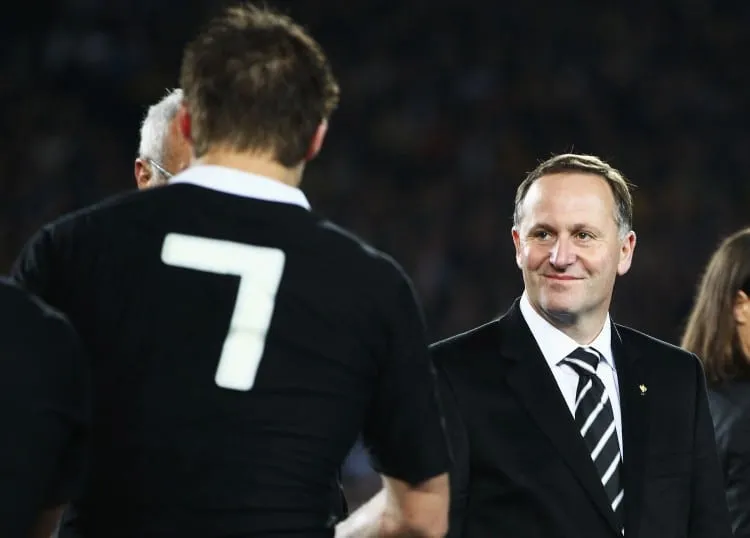 AUCKLAND, NEW ZEALAND - OCTOBER 23: New Zealand Prime Minister John Key shakes hands with Richie McCaw of the All Blacks after the 2011 IRB Rugby World Cup Final match between France and New Zealand at Eden Park on October 23, 2011 in Auckland, New Zealand.  (Photo by Phil Walter/Getty Images)