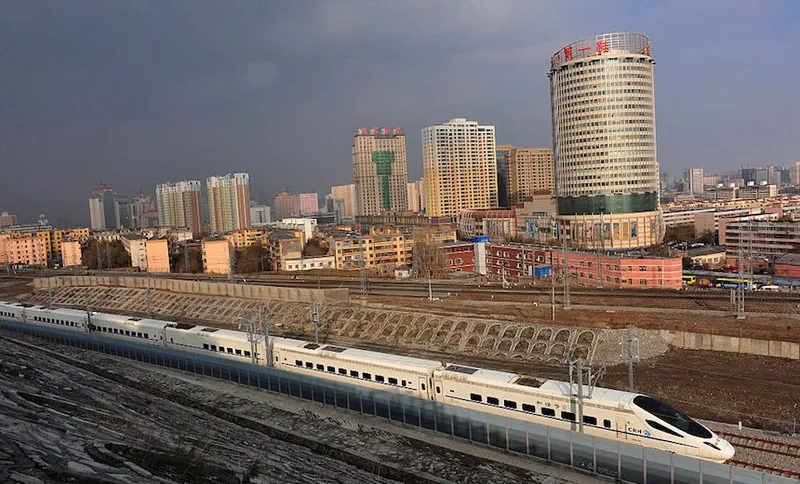 A CRH high-speed train runs across Urumqi city during its test run in China. (Photo by ChinaFotoPress/ChinaFotoPress via Getty Images)