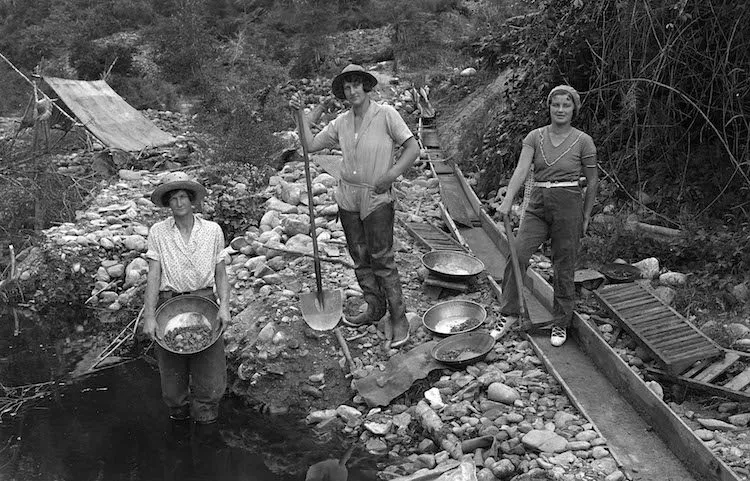 Curiously really modern looking women working the alluvial claims for gold.