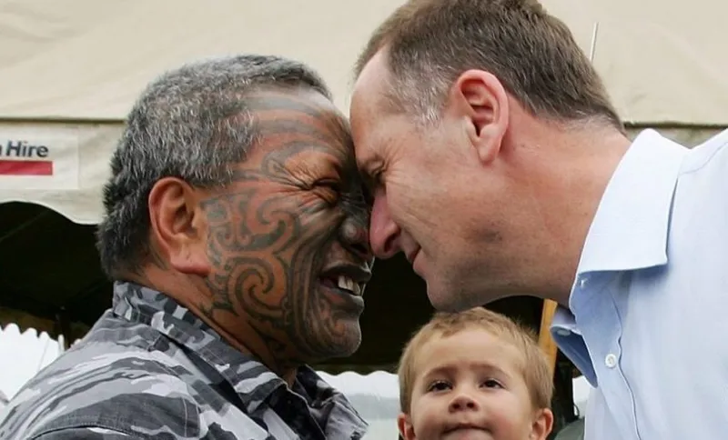 AUCKLAND, NEW ZEALAND - FEBRUARY 05: Leader of the National Party John Key greets Maori Activist Tame Iti at the Te Tii Marae the day before Waitangi Day on February 5, 2008 in Waitangi, New Zealand. Waitangi Day is the national day of New Zealand. It is a public holiday held each year on February 6 to celebrate the signing of the Treaty of Waitangi, New Zealand's founding document, on that date in 1840. (Photo by Hannah Peters/Getty Images)