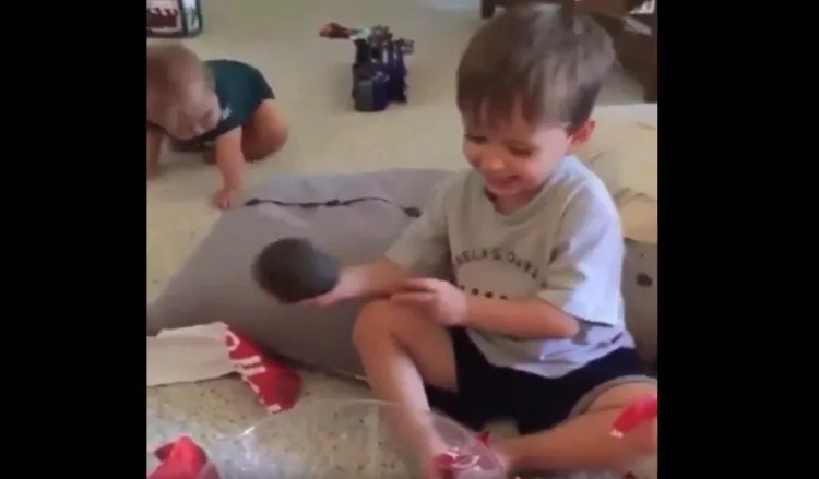 Me unwrapping my deposit book at age ten