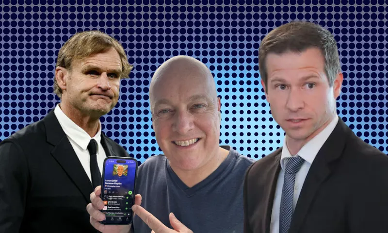 Three men pose in front of a blue dotted background; the man in the center smiles and points at a smartphone displaying an app, while the two men on either side wear suits and have serious expressions.