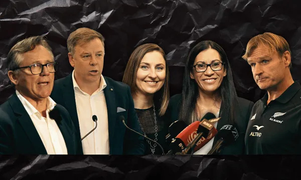 Five people, three men and two women, stand in a row, some speaking at microphones. The background is dark and textured, and they appear to be at a formal press event or announcement.