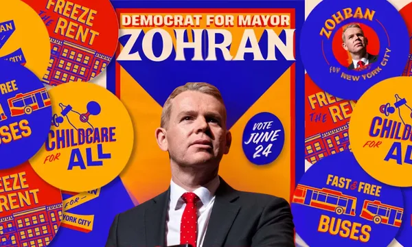 A man in a suit and red polka dot tie stands confidently in front of a campaign poster reading "Democrat for Mayor ZOHRAN", surrounded by colorful buttons promoting "Childcare for All," "Freeze the Rent," and "Vote June 24.